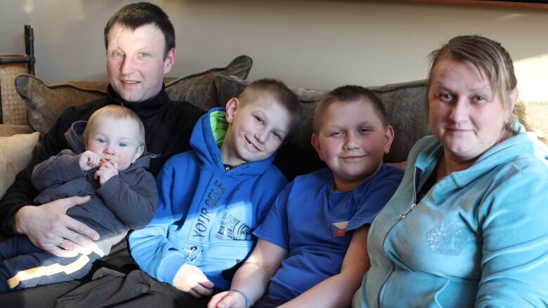 Serhii Malamura (far left), Shusha Malamura, Ivan Malamura, Nazarii Malamura and Inna Molchanova (far right) are pictured at their host family's home in Canmore.