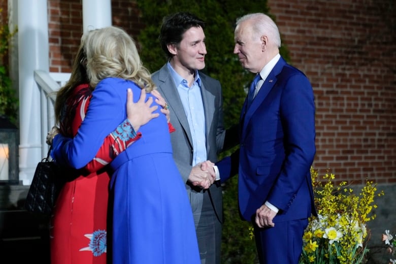 President Joe Biden and first lady Jill Biden are greeted by Prime Minister Justin Trudeau and his wife Sophie Gregoire Trudeau at Rideau Cottage.