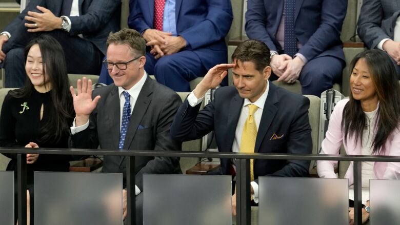 Michael Spavor, centre left, and Michael Kovrig, centre right, receive a standing ovation in the House of Commons.