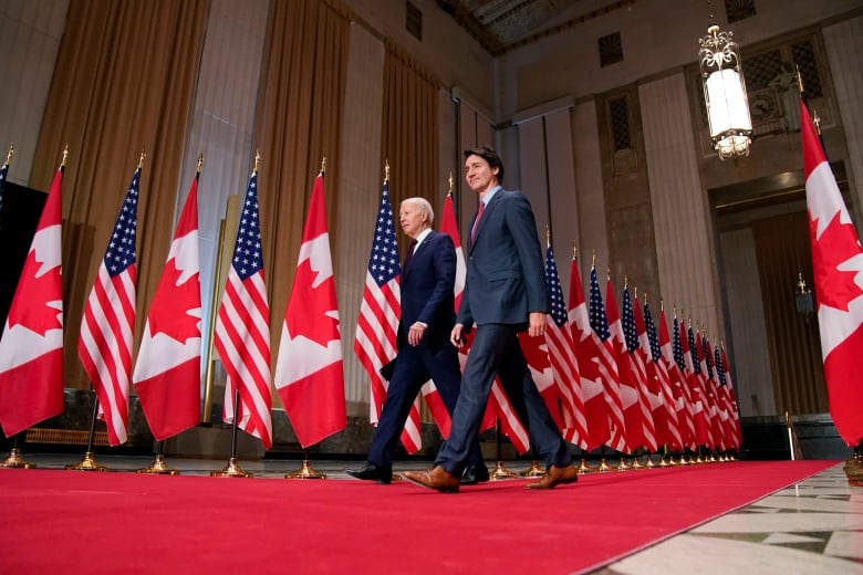 President Joe Biden and Canadian Prime Minister Justin Trudeau arrive for a news conference Friday, March 24, 2023, in Ottawa, Canada. 