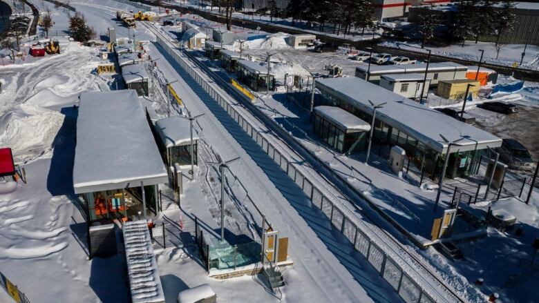 A photo of Carleton University LRT station under construction in winter. 