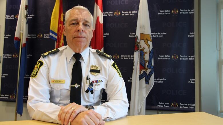 Man in uniform at desk