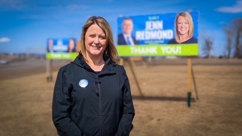 District 5: Mermaid-Stratford MLA Jenn Redmond standing in front of one of her election signs.