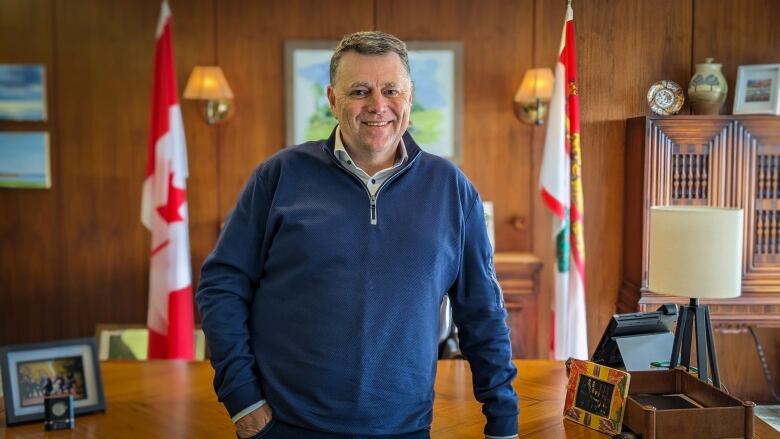 Dennis King standing at his desk in the premier's office the day after his election victory.