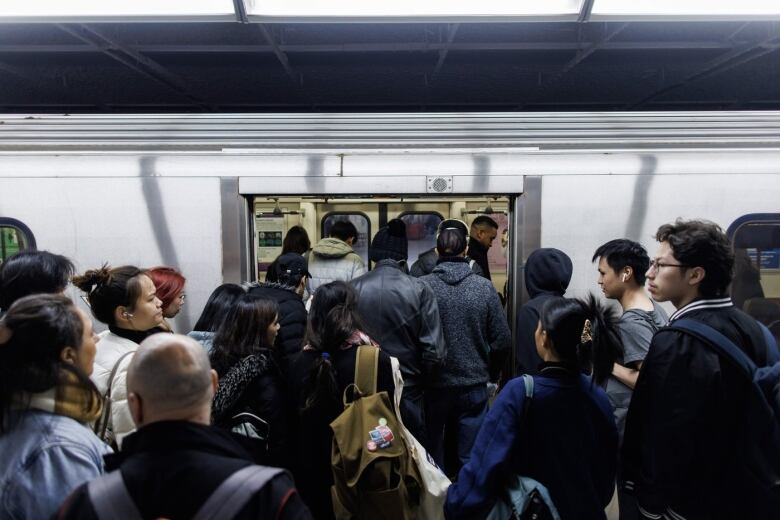 People entering a subway. 