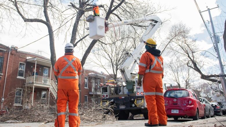 A Hydro-Qubec crew works on a power line following an ice storm in Montreal.