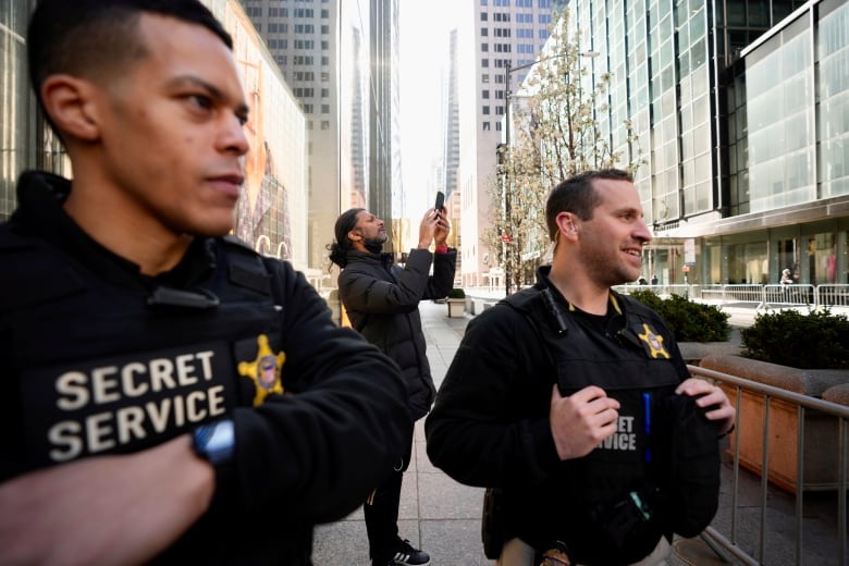 Members of the United States Secret Service stand outside Trump Tower, Monday, April 3, 2023 in New York. Former President Donald Trump is expected to travel to New York to face charges related to hush money payments. Trump is facing multiple charges of falsifying business records, including at least one felony offense, in the indictment handed up by a Manhattan grand jury. (AP Photo/Bryan Woolston)