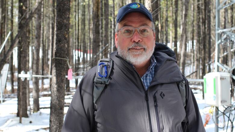 Canmore-based water expert John Pomeroy stands in the forest at Marmot Creek in Kananaskis Country.