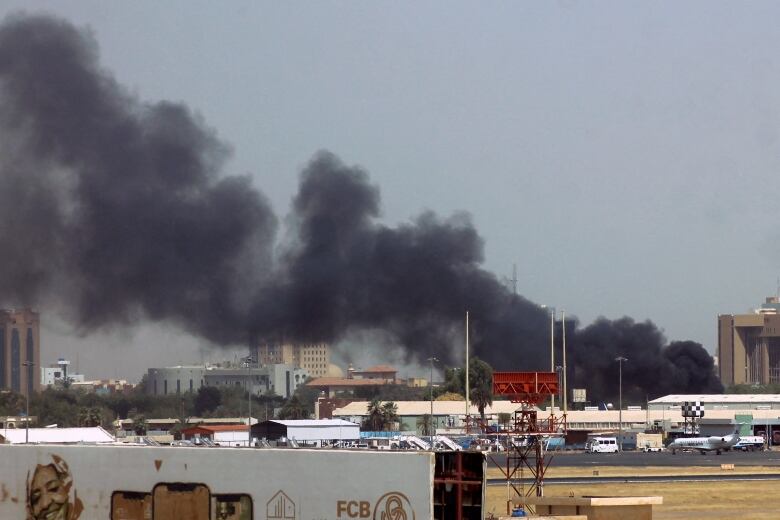 Heavy smoke rising from airport area in Khartoum, Sudan.