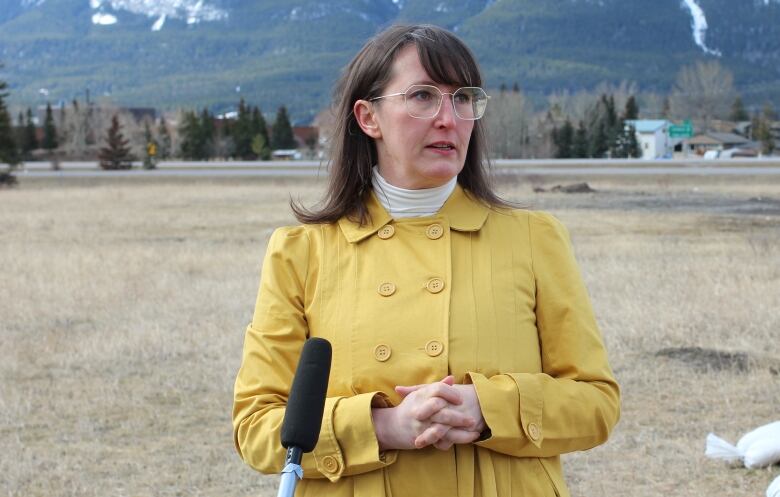 Canmore's deputy mayor, Tanya Foubert, is pictured speaking at an affordable housing announcement.