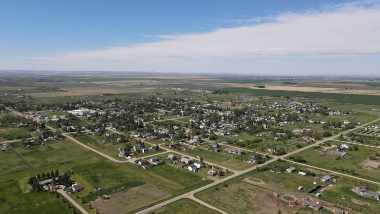 An aerial shot of homes surrounded by fields.