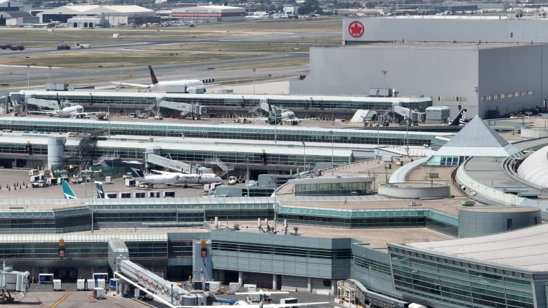 A drone's view of planes at gates.