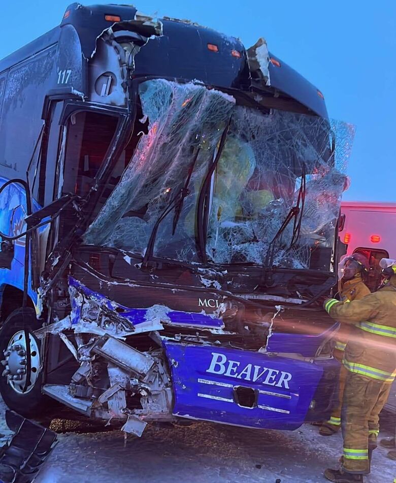 A damaged charter bus is pictured.