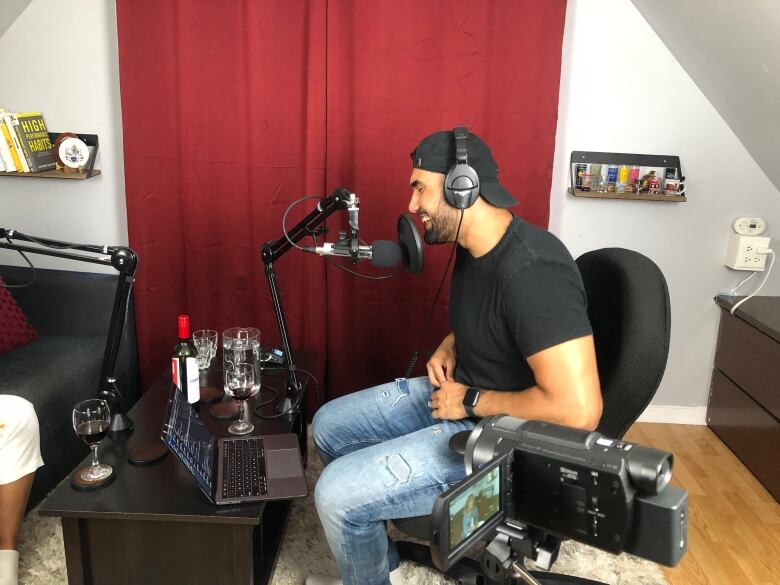 A man in a podcast studio