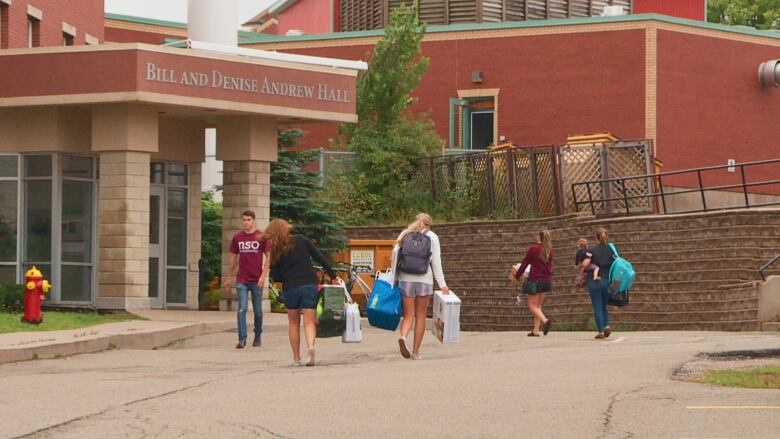 Students walking on UPEI campus.