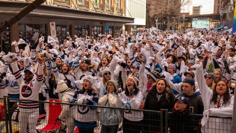 Fans cheering.