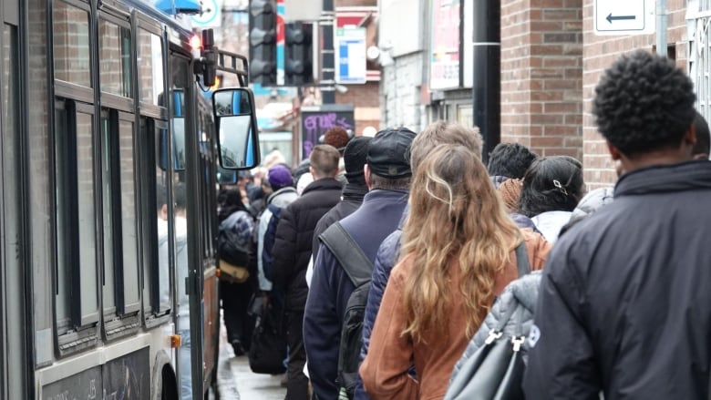 People in line at Montreal bus stop