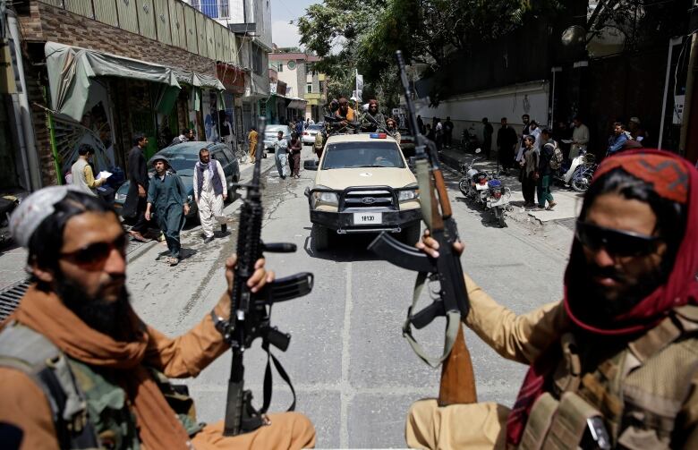 Taliban fighters on patrol, days after the Taliban swept to power in Afghanistan in August 2021.