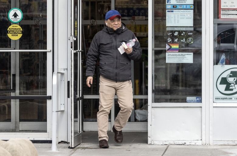 Kenneth Law is seen outside the Mississauga, Ont. pharmacy where a post office box is linked to him.