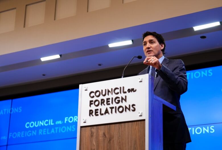 Prime Minister Justin Trudeau speaking at a podium to an audience at the Council on Foreign Relations in New York. 