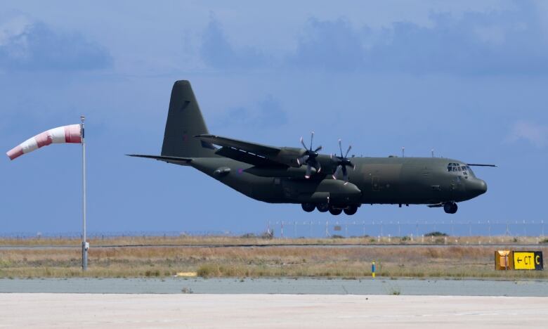 A British military plane lands in Cyprus.