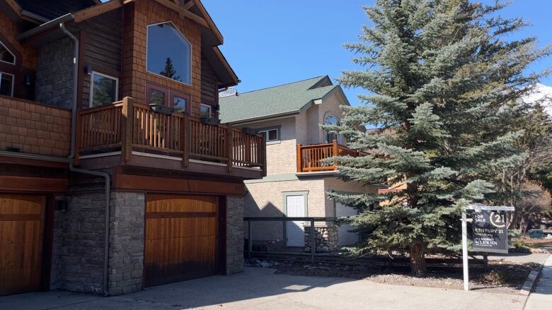 A house with a for sale sign is pictured in Canmore, Alta. 