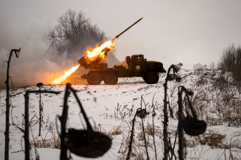 Ukrainian military fires from a multiple rocket launcher at Russian positions in the Kharkiv area, Ukraine, Saturday, Feb. 25, 2023. The Biden administration declared its Ukraine solidarity with fresh action as well as strong words on Friday, piling sweeping new sanctions on Moscow and approving a new $2 billion weapons package to re-arm Kyiv a year after Russia's invasion.