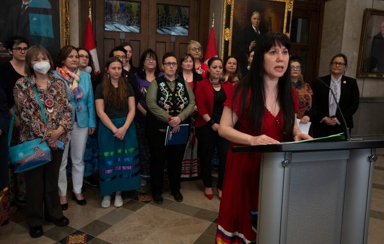 Leah Gazan, NDP MP for Winnipeg Centre, surrounded by family members of missing and murdered Indigenous women, girls and two-spirit people, speaks during a news conference on Tues. May 2, 2023 in Ottawa.