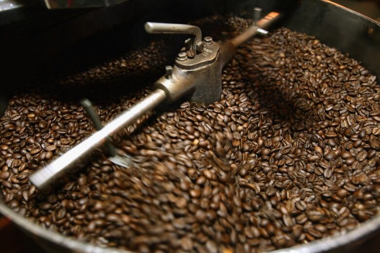 Coffee beans in a roaster.