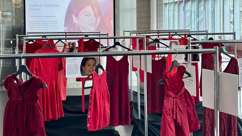 A wide picture of the Red Dress exhibit at HPL. 