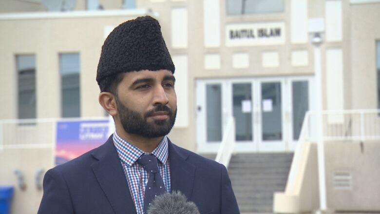 A man is pictured outside a mosque in Vaughan, Ont.