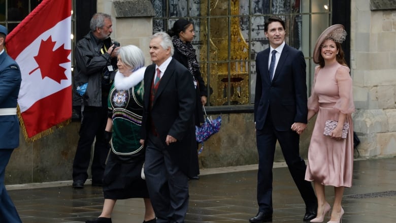 See the prime minister of Canada, Justin Trudeau, arrive at the coronation of King Charles alongside his wife,  Sophie Grgoire Trudeau, on a misty, foggy Saturday in London. Also seen are Gov. Gen Mary Simon and her husband, Whit Fraser.