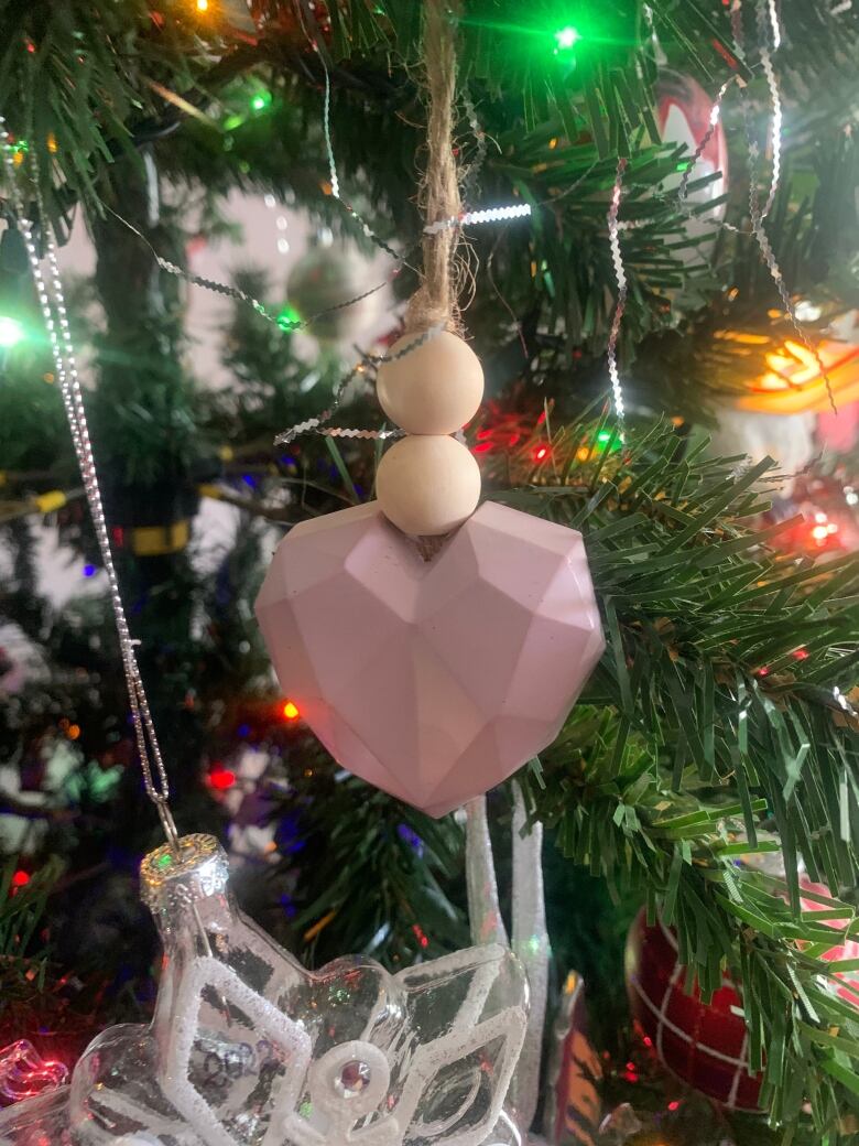 heart shaped ornament on Christas tree 