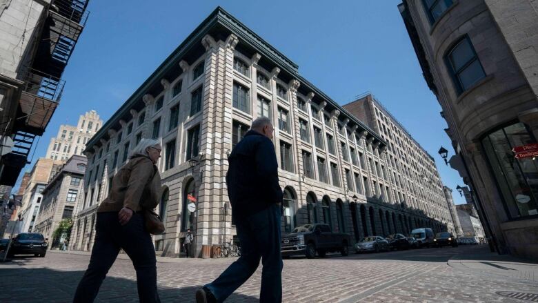 two men walking in old montreal