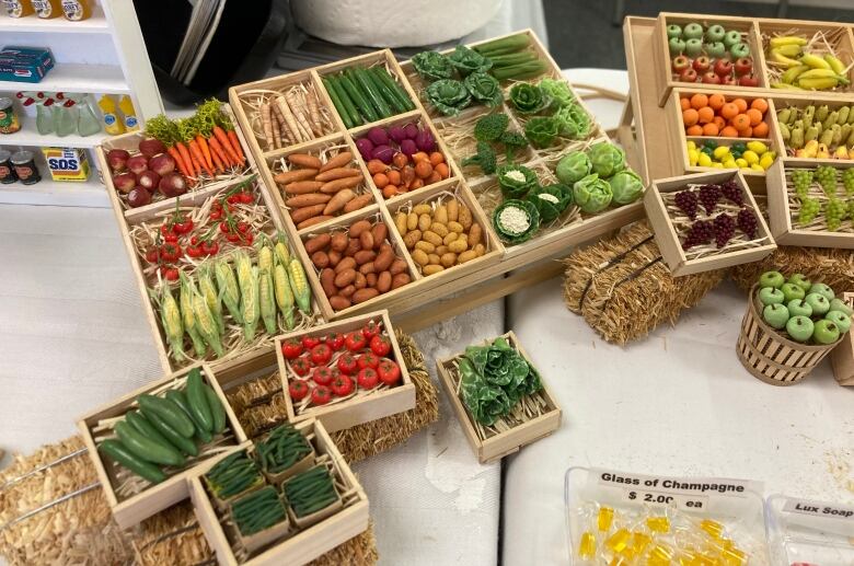 Tiny wooden boxes filled with miniature produce