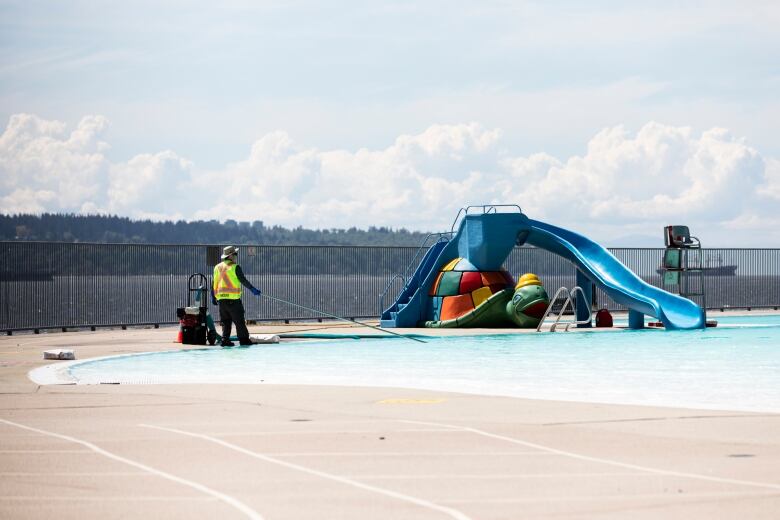 Worker prepares 2nd beach outdoor pool ahead of Vancouver's first heatwave of the season.