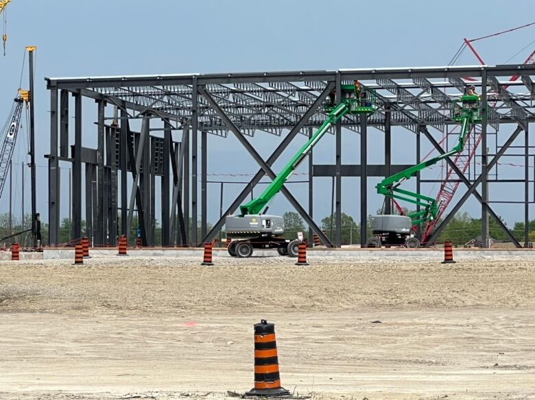 A crane near the frame of a metal building