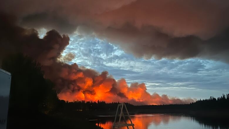 Flames, smoke, trees and water.