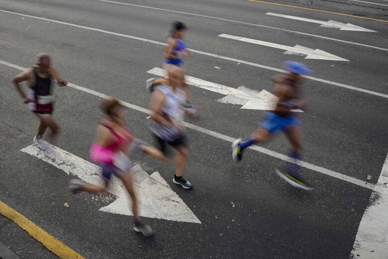 Runners are shown in this Sunday, Dec. 11, 2022 file photo. 