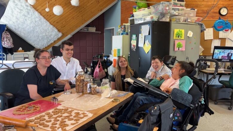 A group of people around a table.