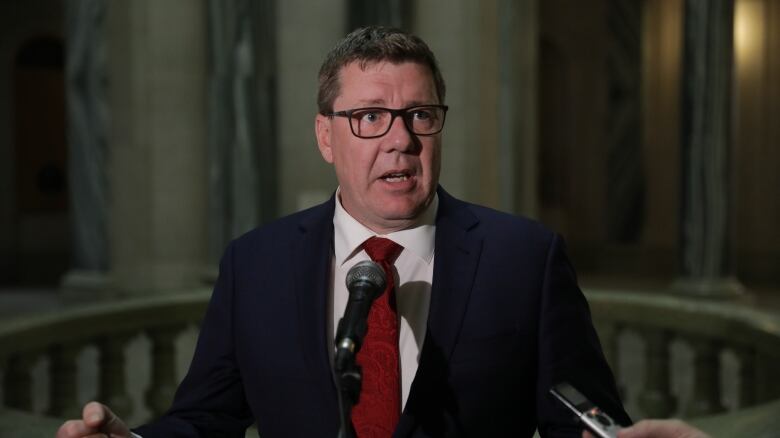 Premier Scott Moe speaks with media at the Saskatchewan legislature on May 15, 2023. 