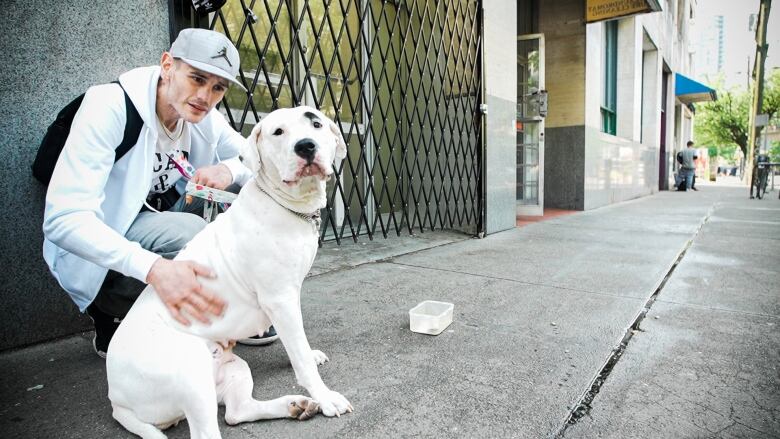 Chris D. says even his dog Karma gets spooked when friends are having bad trips while using drugs on the DTES but he understands they aren't able to control their behaviour.