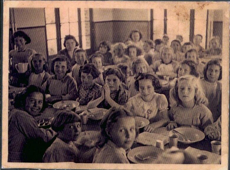 A group of young girls at a table.