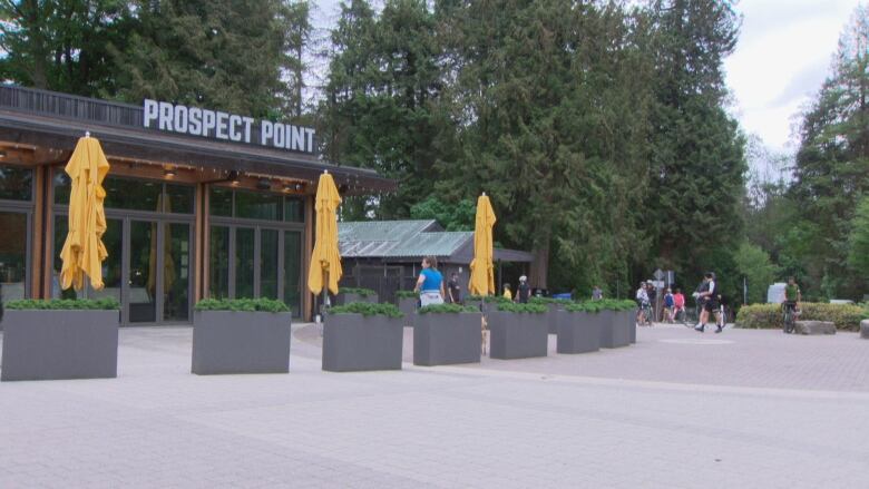 The storefront of Prospect Point is pictured, closed with folded umbrellas. 