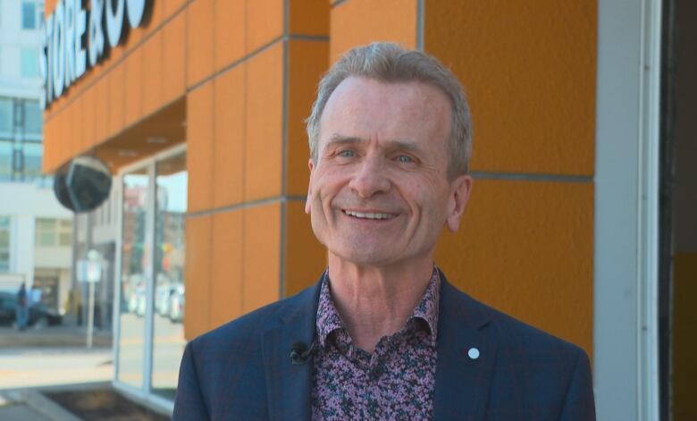 Strategic Groups  Senior Vice President Development Ken Toews stands in front of Store & Go, a storage facility. 