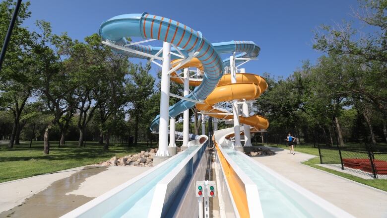 Two waterslides feed toward the camera. 