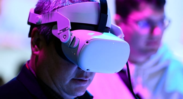 Close up photo of a man wearing a VR headset.