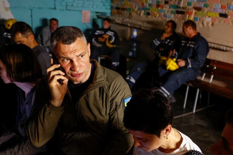 Kyiv Mayor Vitali Klitschko and others take cover inside a shelter during an air-raid alert.