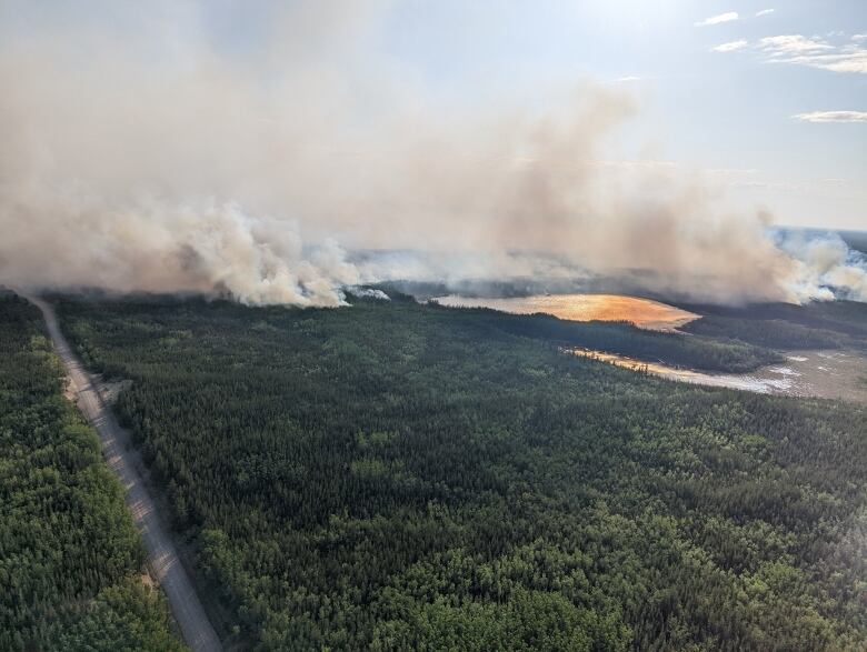 Aerial photo of fire burning near Pine Lake in Wood Buffalo National Park.