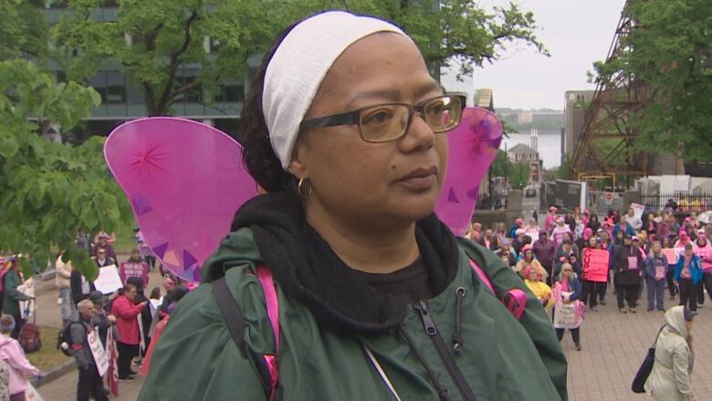 A woman with glasses and a headband.